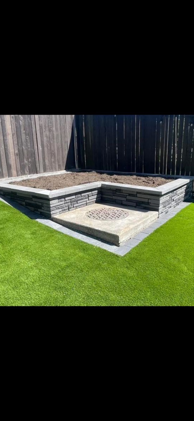 Small paver area with turf and boulder border