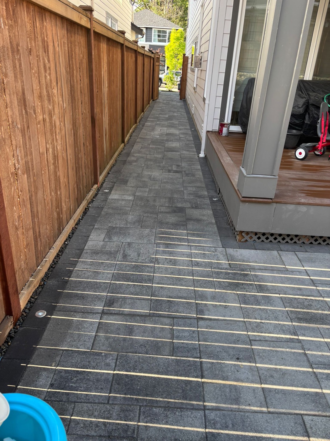 Side yard steps, pavers, rock, and turf landing