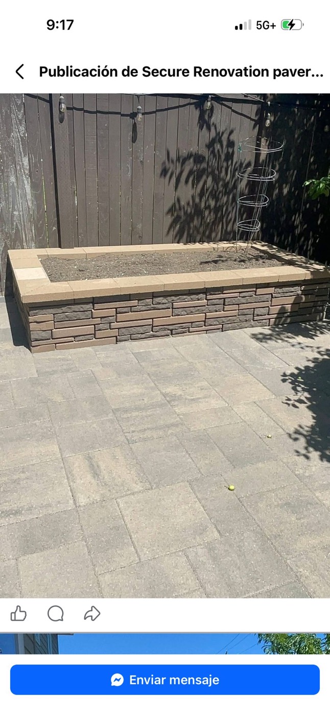 Small finished paver pad and raised stone wall